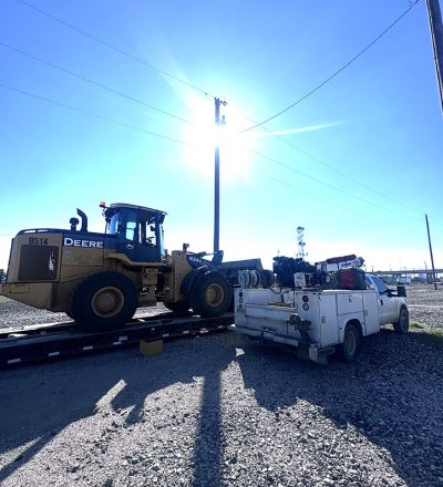 A bulldozer parked on a dirt lot